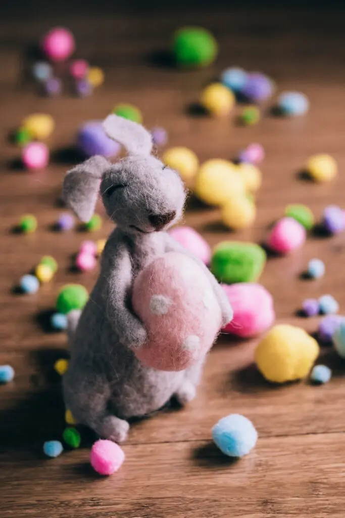 Felted bunny holding an easter egg